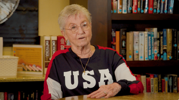 Senior resident engaging in conversation indoors