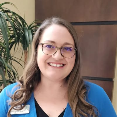 Smiling staff member in a common area