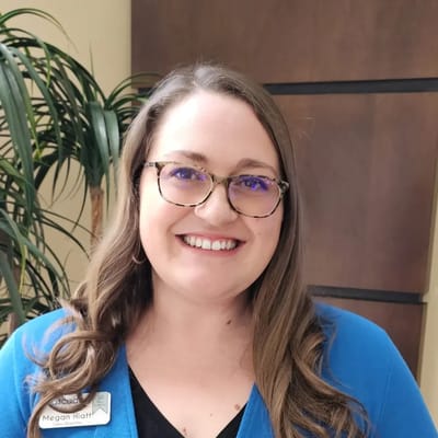 Smiling staff member in a common area