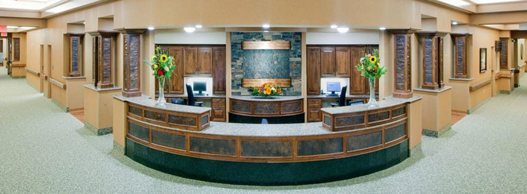 Brightly lit reception area with floral arrangements