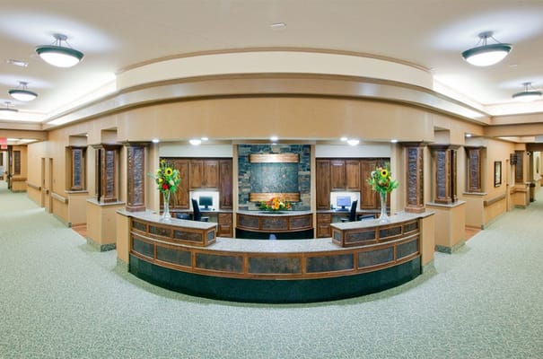 Interior view of a nursing home lobby with reception area