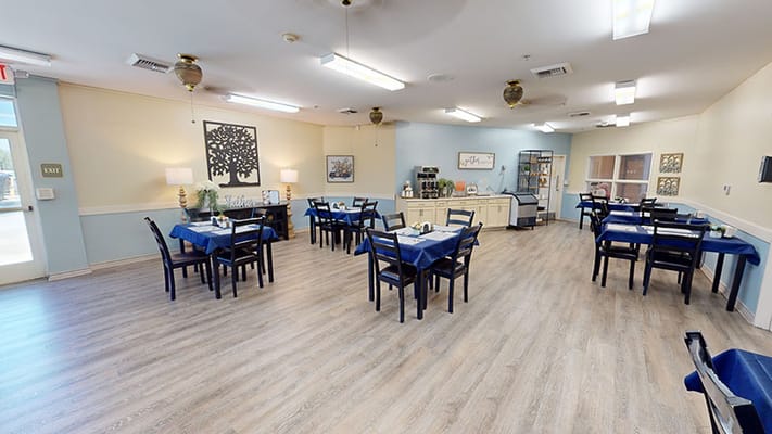 Dining room with tables set for residents