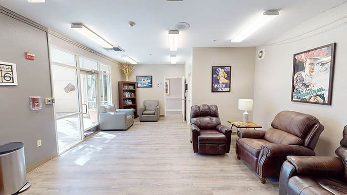 Lounge area with comfortable seating and artwork