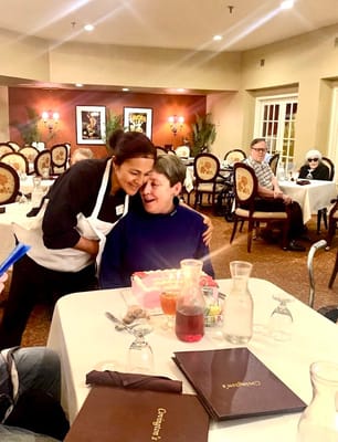Celebration in the dining room with staff and residents