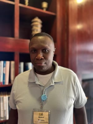 Staff member posing in a library area
