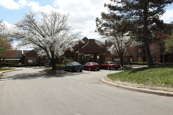 Exterior view of the facility with trees in bloom