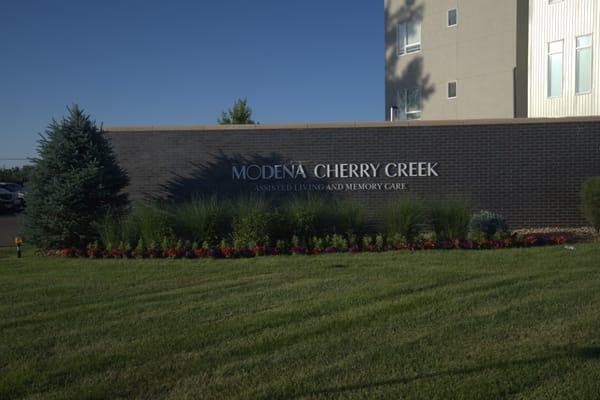 Exterior view of Modena Cherry Creek with landscaped entrance