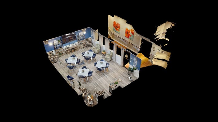 Spacious common area with tables and seating