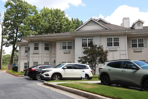 Exterior view of the facility with parked cars