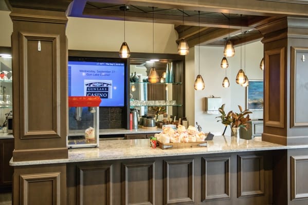 Interior view of a community lounge with service counter