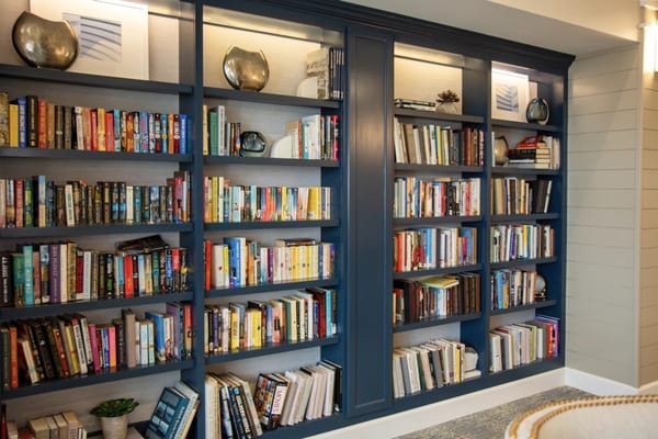 Interior view of a well-stocked library with bookshelves