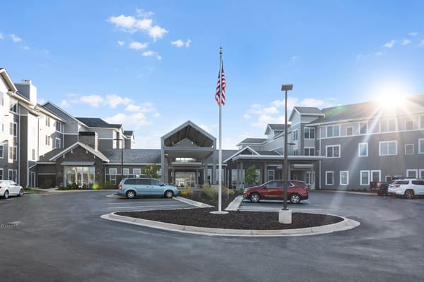 Exterior view of Rivertown Ridge with flag and entrance