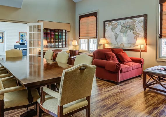 Common area with a large table and seating