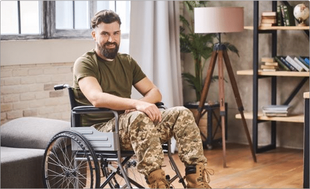 A young man in a wheelchair sitting in a modern living room