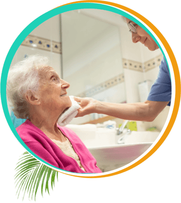 Caregiver assisting an elderly resident with personal hygiene