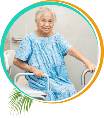 Resident sitting in a brightly lit bathroom