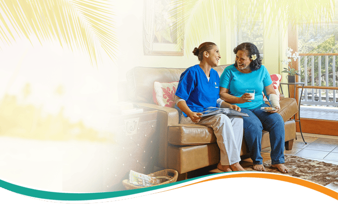 Caregiver and resident enjoying a moment together in a cozy lounge area