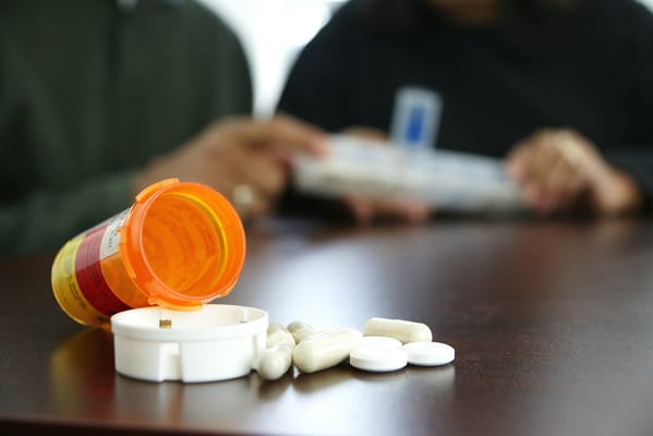 Medication bottles and pills on a table
