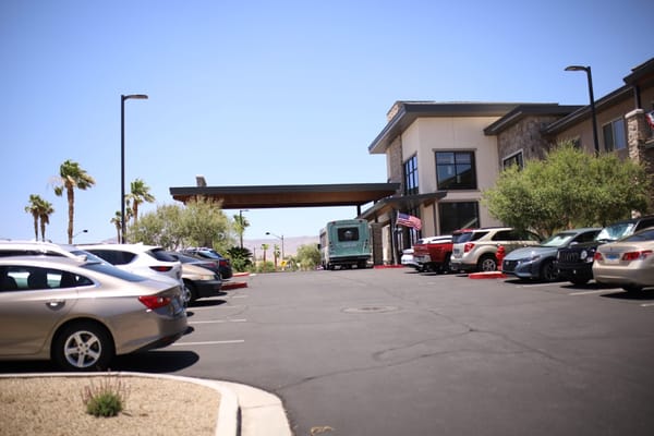 Exterior view of Legacy House with parking area