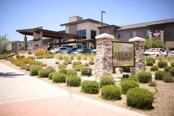 Exterior of Legacy House building with landscaped entrance