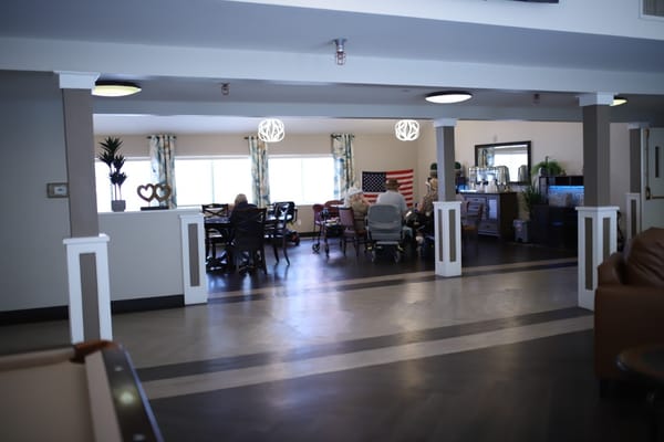 Residents socializing in the lounge area of Sterling Ridge Senior Living.