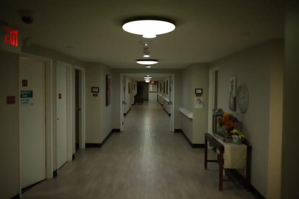 Brightly lit hallway in senior living facility