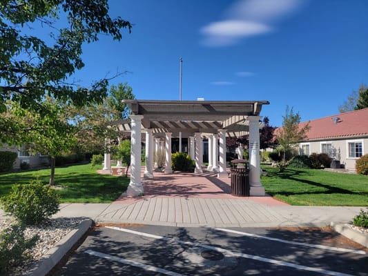 Entrance of a senior living facility with outdoor space