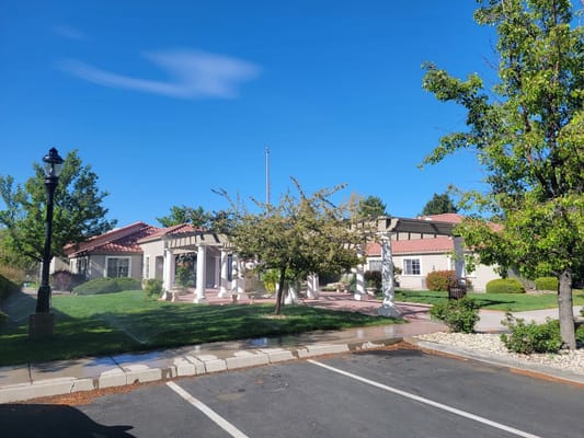 Exterior view of a senior living facility on a sunny day
