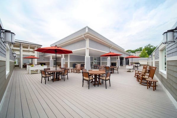 Outdoor patio with seating and umbrellas