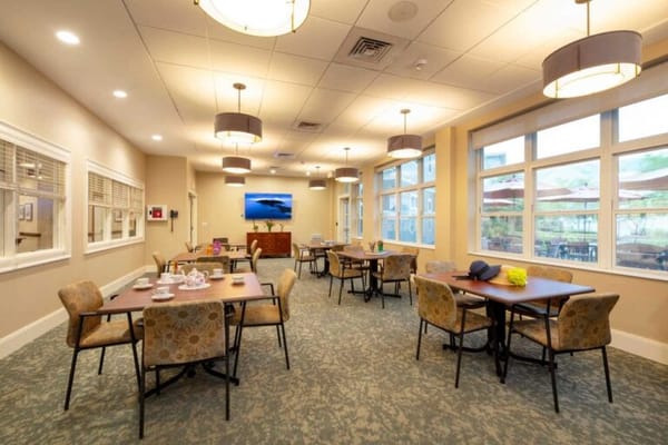Bright common area with tables and chairs
