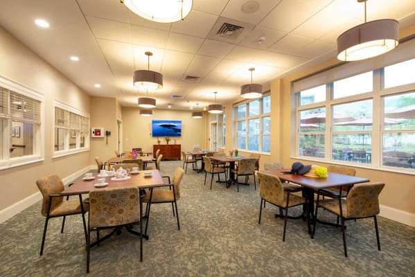 Bright common area with tables and chairs