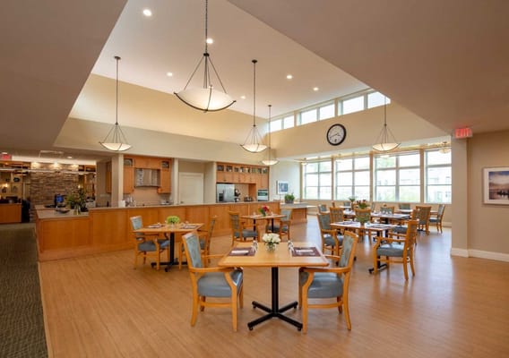 Dining area with tables and chairs in a bright interior