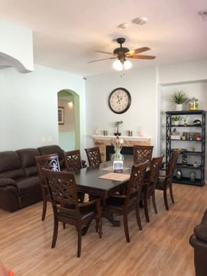 A cozy common area with a large dining table