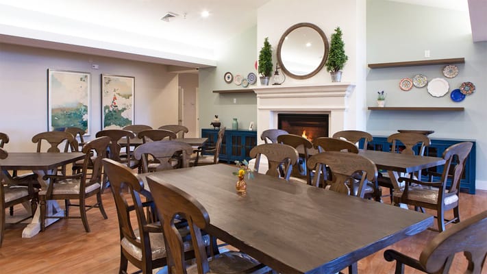 Bright dining room with wooden tables and chairs