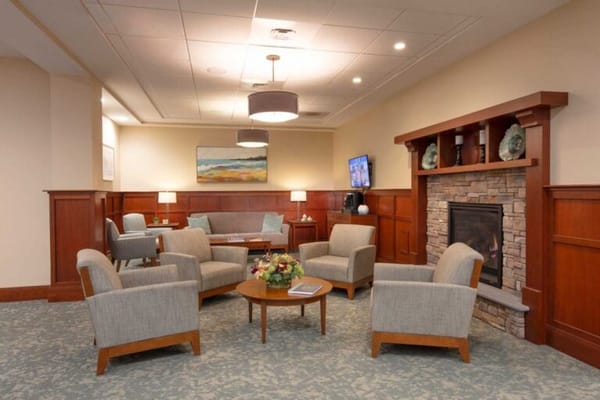 Interior common area with seating and a fireplace