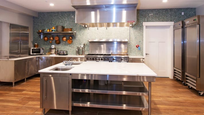 Modern kitchen with stainless steel appliances and decor