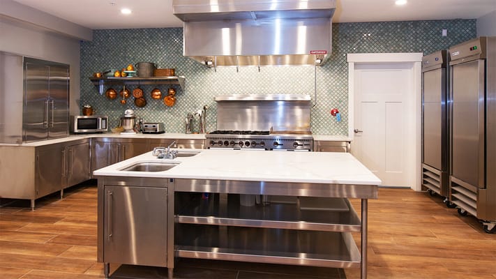 Modern kitchen with stainless steel appliances and decor