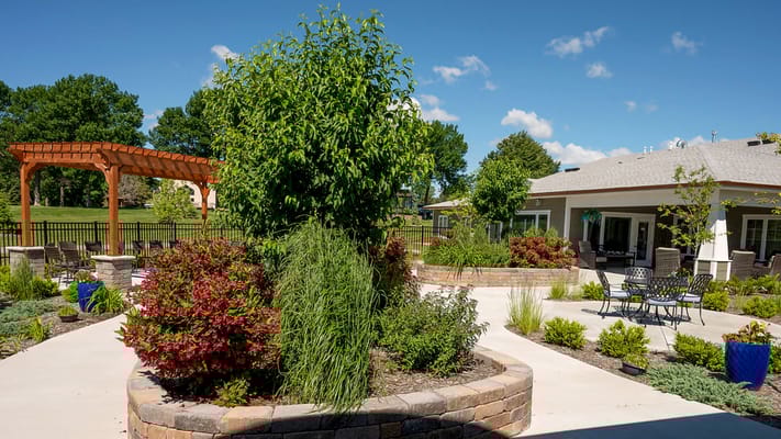 Lush outdoor garden with landscaped pathways and seating