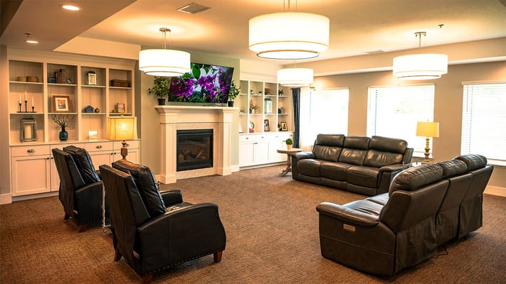 Interior common area with seating and a fireplace