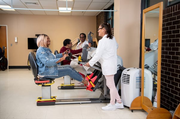 Residents engaging in physical therapy exercise session