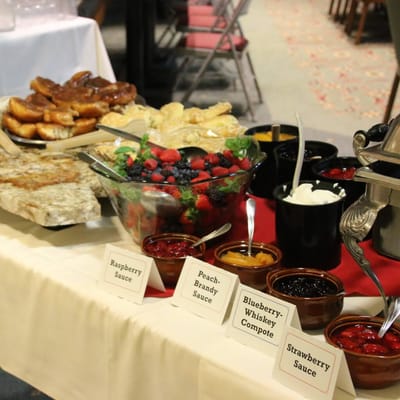 Variety of sauces and pastries on a dining table