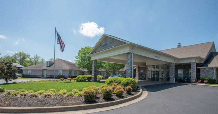 Front entrance of a senior living facility on a sunny day