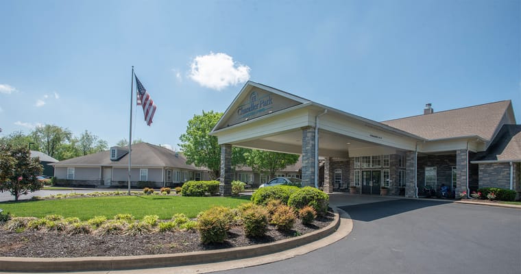 Front entrance of a senior living facility on a sunny day