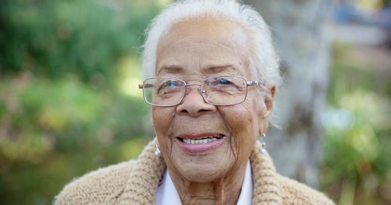 Close-up of a smiling senior woman outdoors