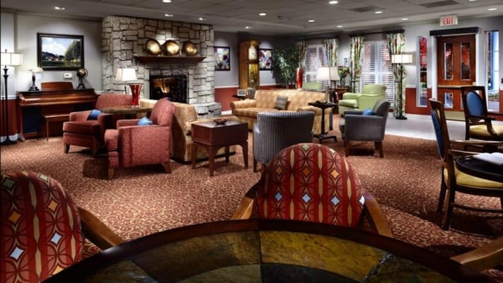 Cozy common area with seating and a fireplace