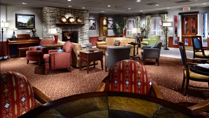 Cozy common area with seating and a fireplace