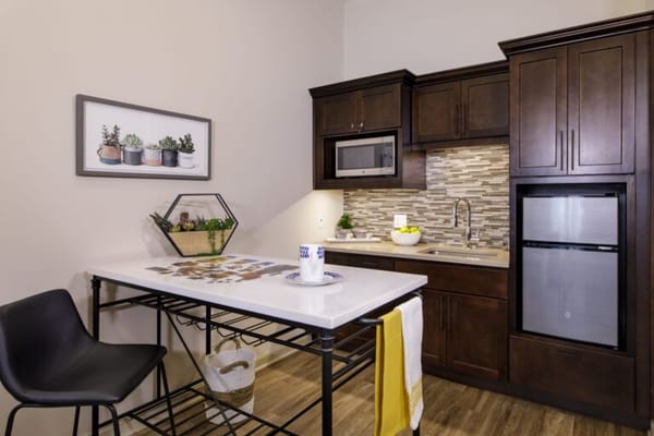 Modern kitchenette with dining space and decor