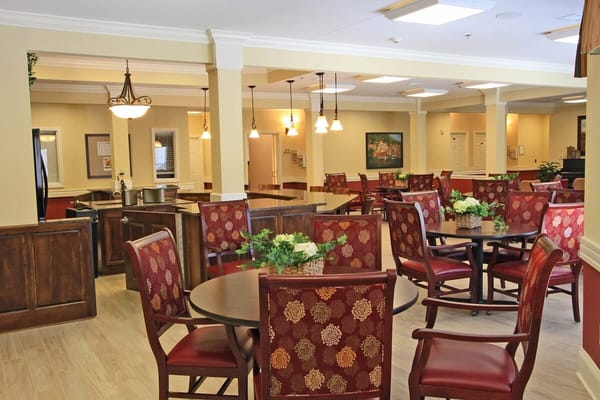 Bright dining area with tables and chairs