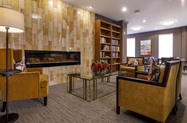 Cozy common area with seating and bookshelves