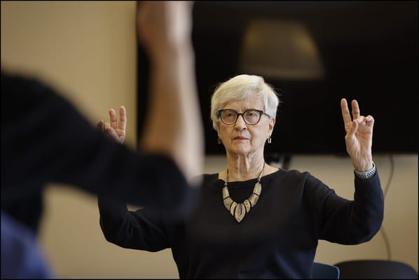 Senior resident engaged in activities during a class